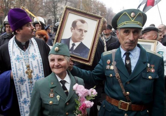 Veterans of the Ukrainian Insurgent Army (UPA) a fascist, ultranationalist formation, hold portrait of Stepan Bandera.