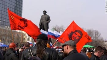 Demonstrators wave revolutionary flags at a major pro-Russia rally in Lenin Square in central Donetsk.