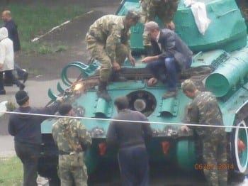 NAF fighters work to restore T-34 for combat against Kiev.