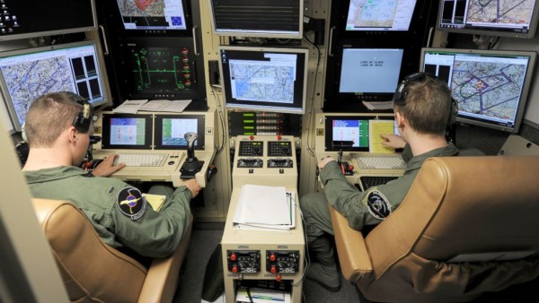 Drone "pilots" in their control room. A glorified video game where humans, as Wikileaks showed, become mere "bugs" to be "splattered." Where's the honor in all this? (ABC News)