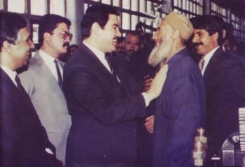 The President of the Republic of Afghanistan, General Dr. Mohammad Najibullah, during a visit to a factory.