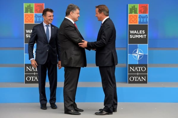 Petro Porososhenko amid fellow war criminals David Cameron and US lackey NATO chief Gen. Anderss Fogh Rasmussen. (NATO, via flickr)