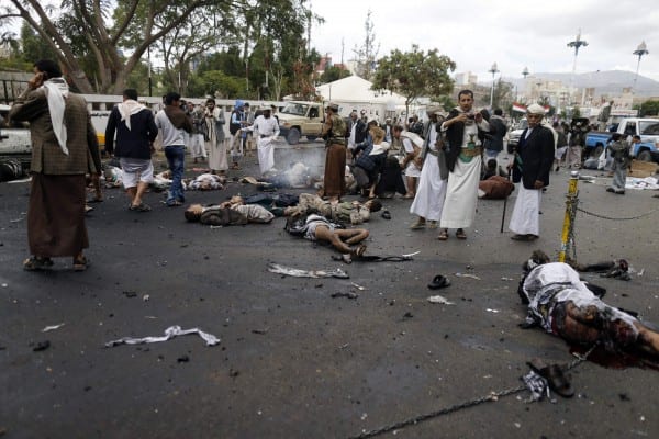 Dead and wounded people are seen at the scene of a suicide attack in Sanaa