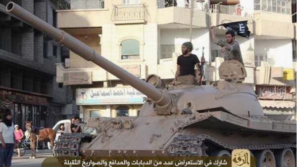 ISIS militants with captured tank. 