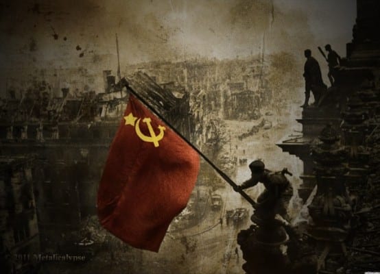 Soviet flag over the Reichstag. Iconic image comparable to the Marines raising the flag in Iwo Jima.