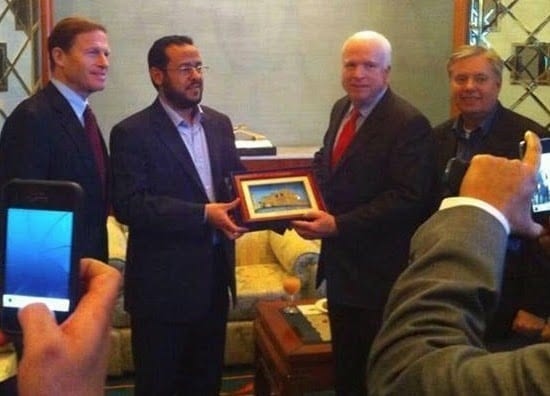 John McCain proudly standing with Abdelhakim Belhadj, with the equally reprehensible Lindsey Graham in tow. 