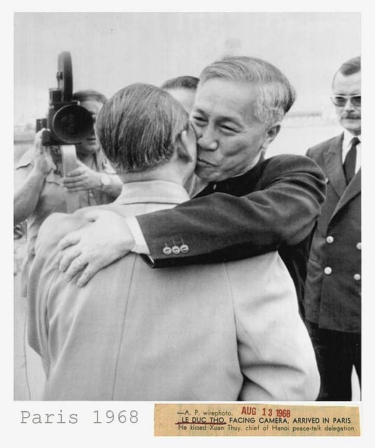 Le Duc Tho, chief adviser to the Vietnamese Paris peace delegation, embracing his comrade Xuan Thuy. head of the North Vietnam negotiators.