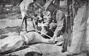 We've been at it for along time. Water torture being used by US marines on a Filipino patriot. (1902)