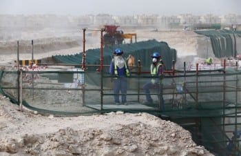 Foreign laborers work at the construction site of the al-Wakrah football stadium, one of the Qatar's 2022 World Cup stadiums, on May 4, 2015, in Doha's Al-Wakrah southern suburbs. AFP PHOTO / MARWAN NAAMANI / AFP / MARWAN NAAMANI